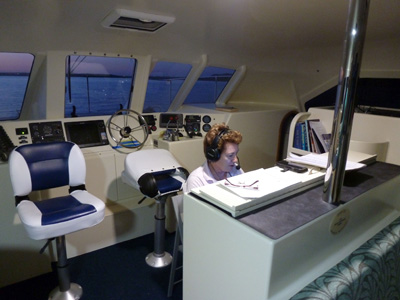catherine operating radio on boat
